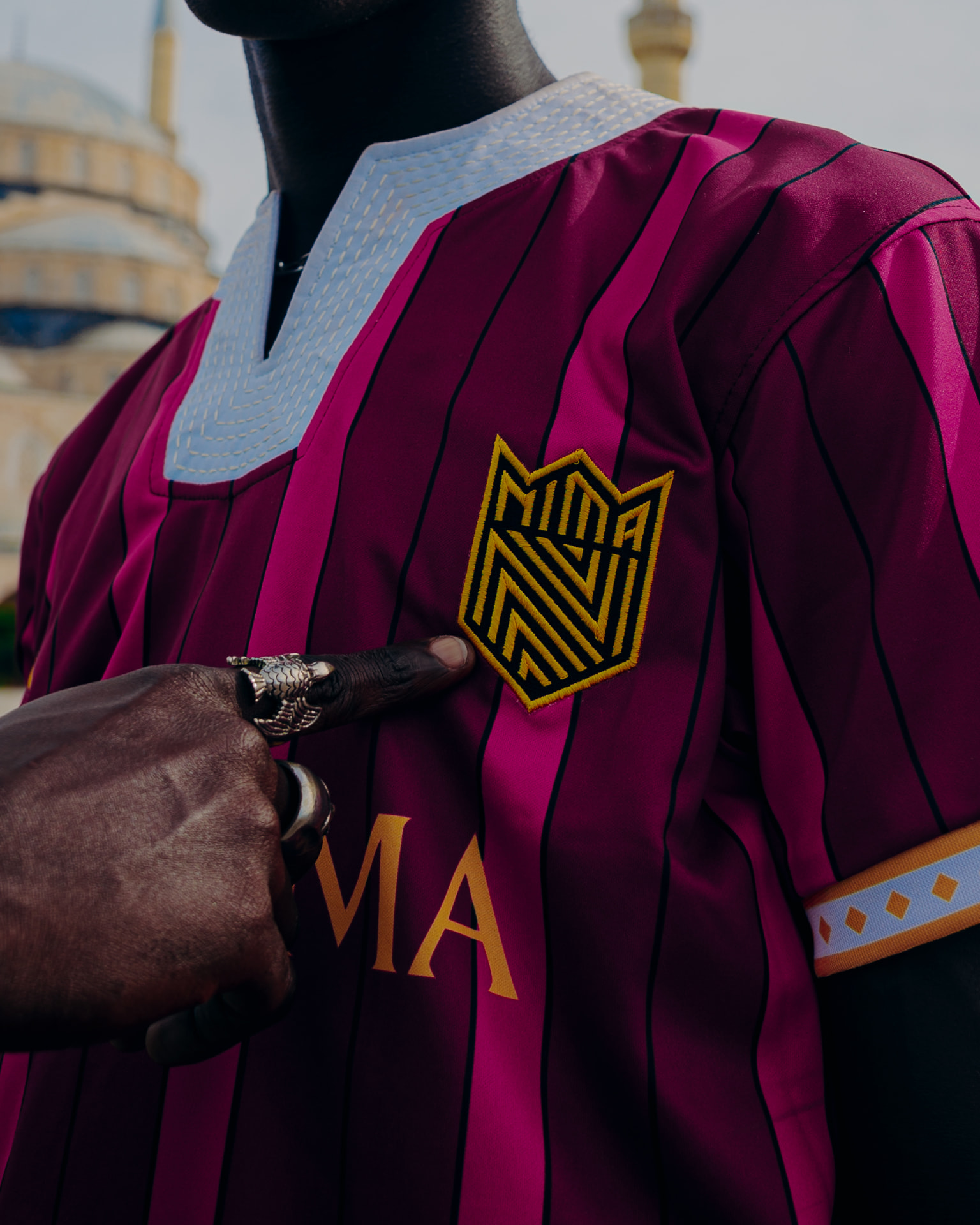 Supporter showing the Nima Kings FC crown crest